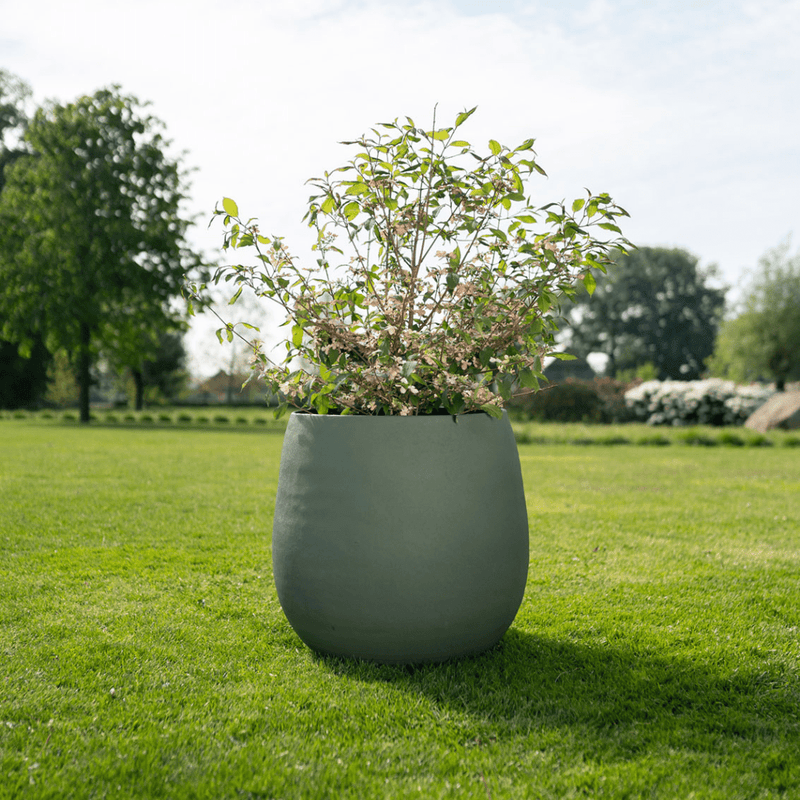 





Kruk Stijn matt grön - Lifestyle foto kunstplant in interieur
